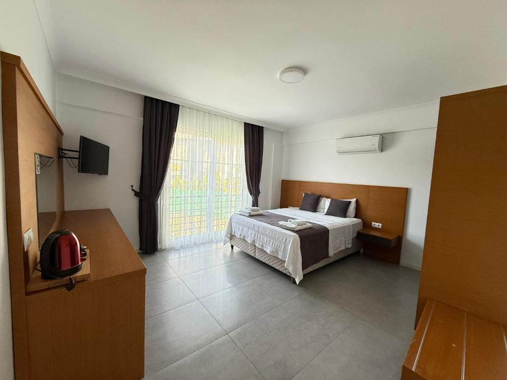 Postel nebo postele na pokoji v ubytování AdaHan Family Rooms Gocek