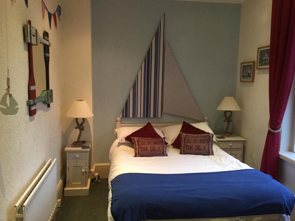 Postel nebo postele na pokoji v ubytování Hotel Rudyard