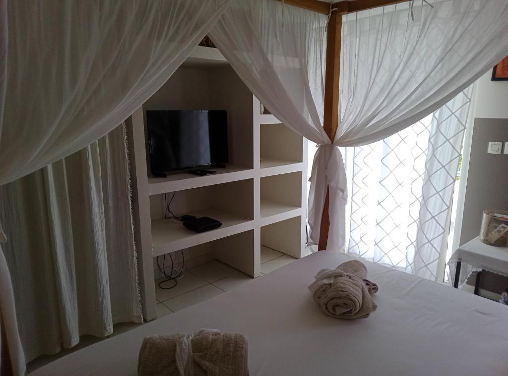 Postel nebo postele na pokoji v ubytování Chambre d'hôte friar's bay
