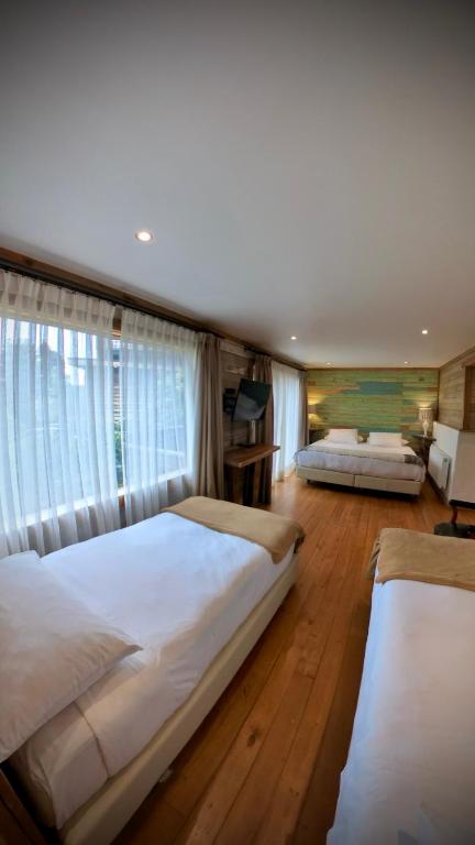 Postel nebo postele na pokoji v ubytování Hotel Agua Nativa