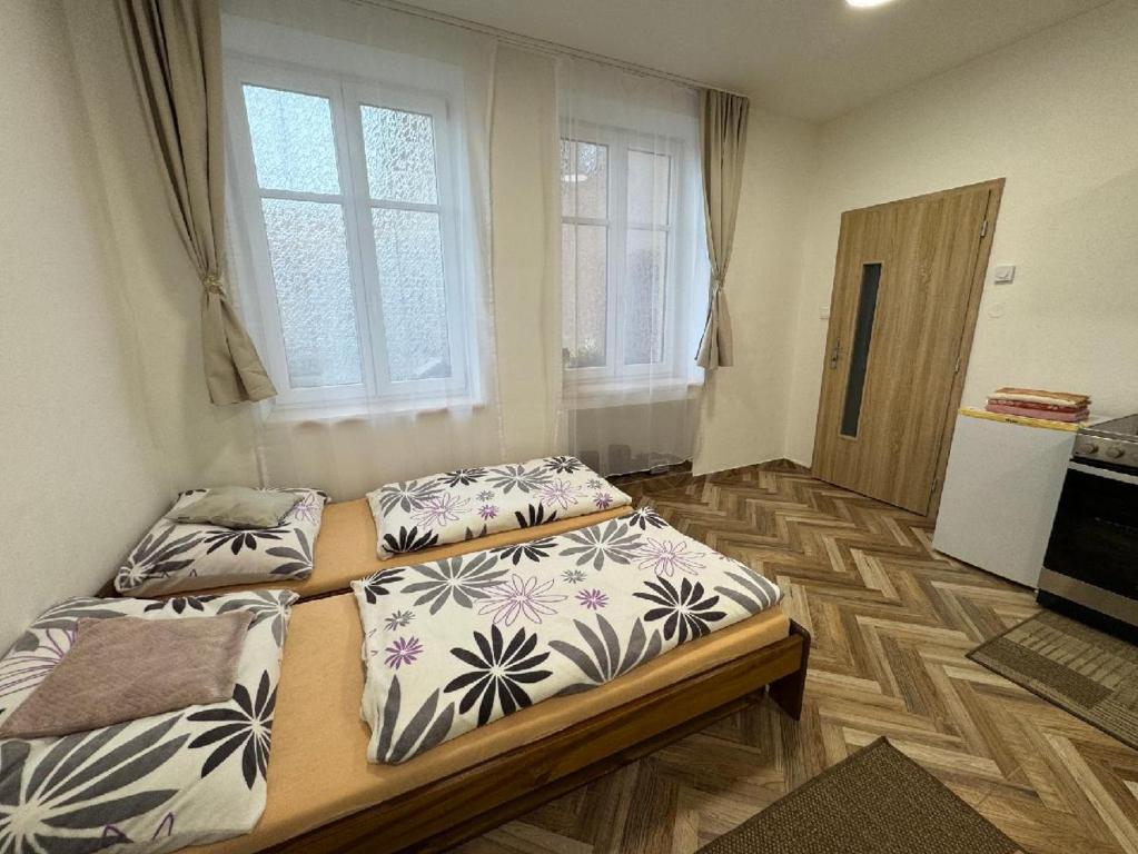 Postel nebo postele na pokoji v ubytování Holičák