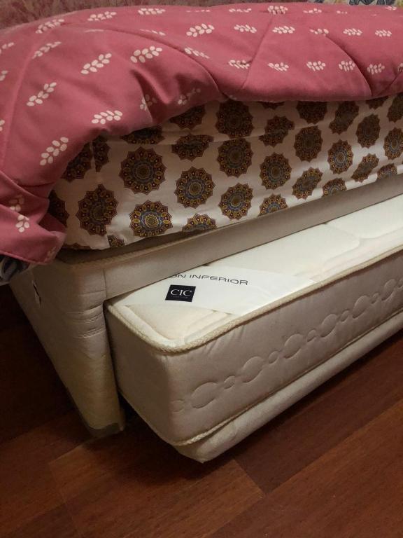 Una cama o camas en una habitación de Hostal Hibisco