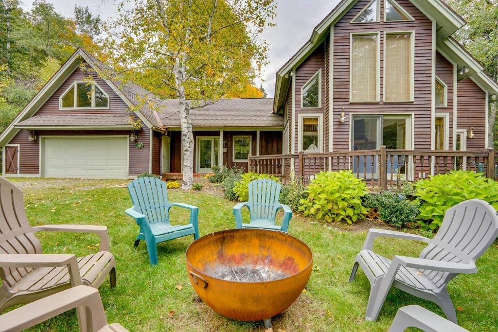 a yard with chairs and a fire pit in front of a house at Spacious Dover Refuge about 5 Mi to Mount Snow! in Dover