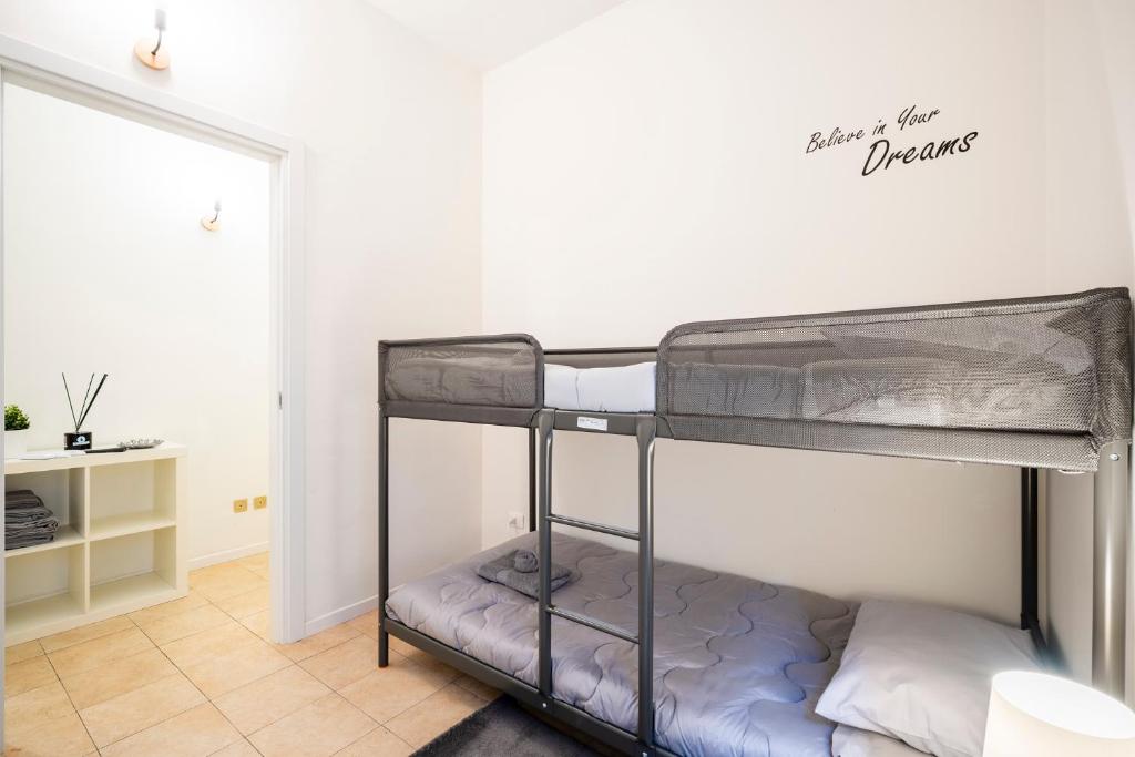 Letto o letti in una camera di Giardino a Milano - Elegante Appartamento