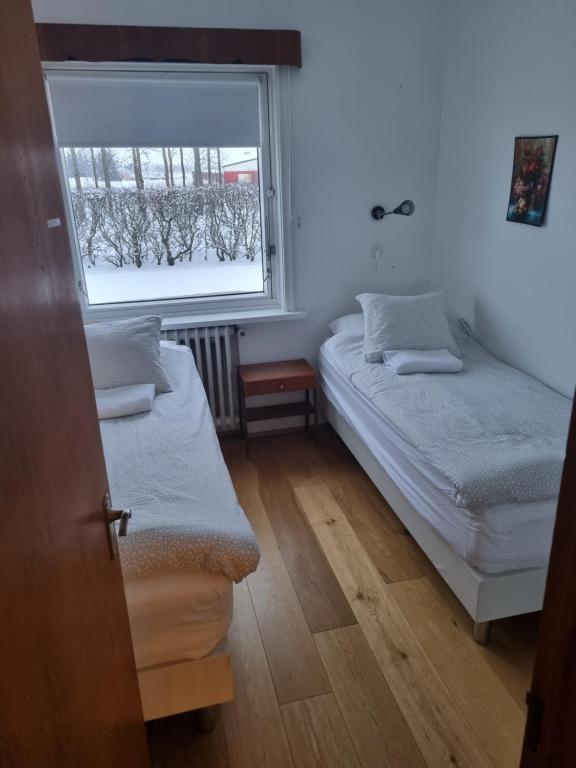 Postel nebo postele na pokoji v ubytování Spói Guesthouse