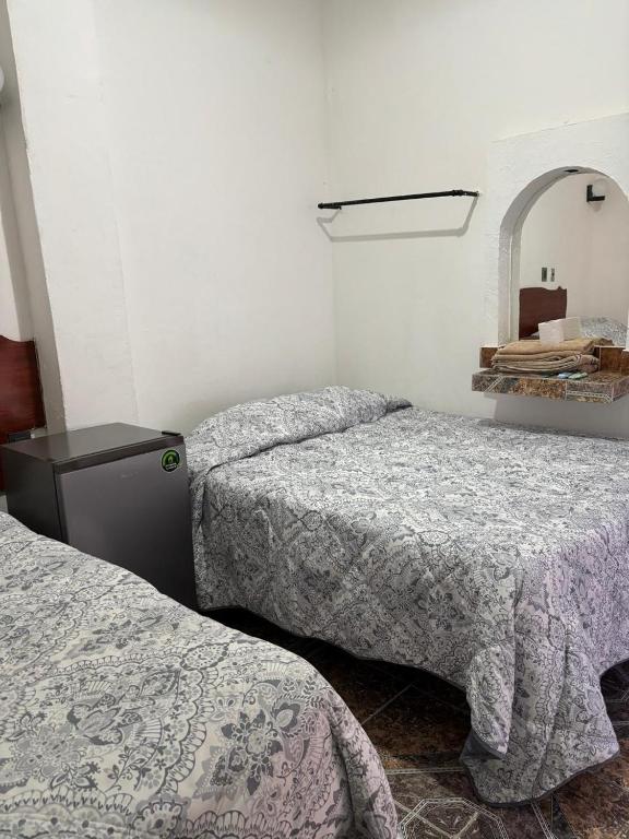 Postel nebo postele na pokoji v ubytování Hotel Climar