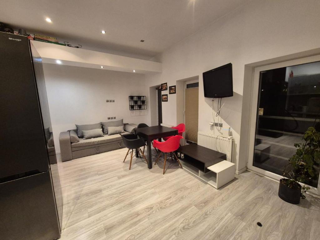 a living room with a table and a couch at Szczecin Centrum in Szczecin