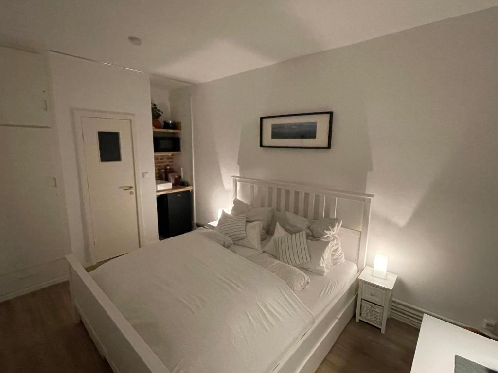 Postel nebo postele na pokoji v ubytování Appartment am Blankeneser Markt