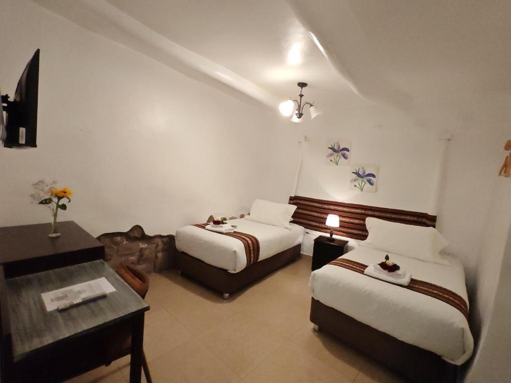 Katil atau katil-katil dalam bilik di Afma Cusco