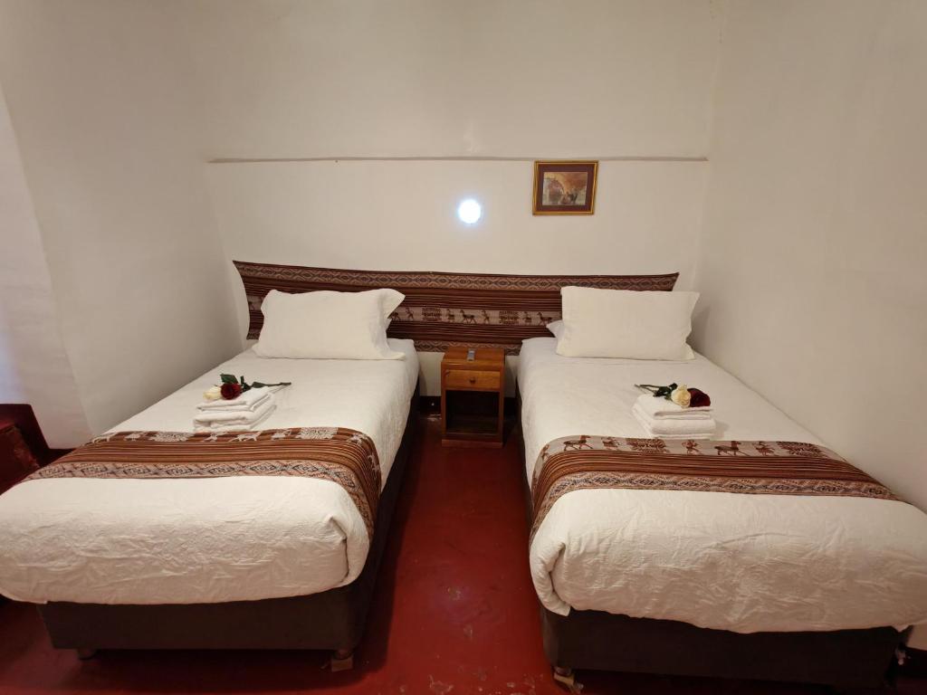 Katil atau katil-katil dalam bilik di Afma Cusco