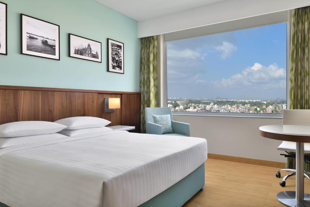 Postel nebo postele na pokoji v ubytování Fairfield by Marriott Kolkata