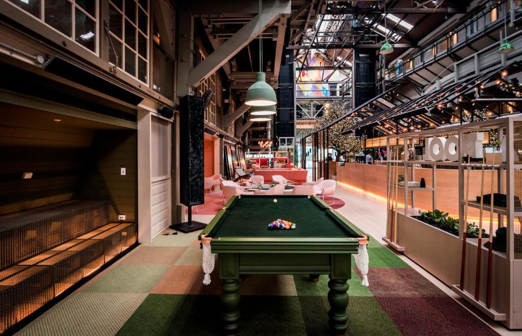 a room with a pool table in a building at Ovolo Woolloomooloo in Sydney