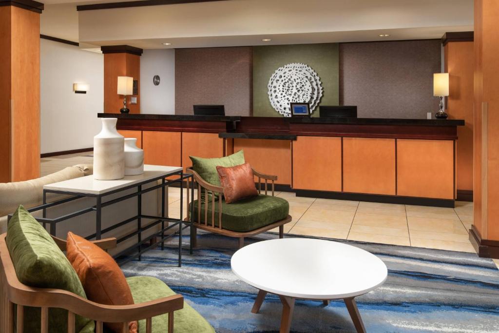a lobby with a waiting area with chairs and a table at Fairfield Inn & Suites Chattanooga I-24/Lookout Mountain in Chattanooga