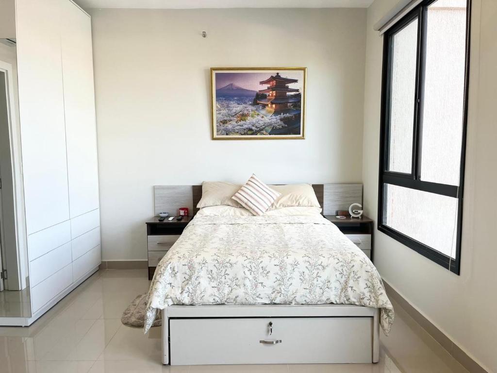 a bedroom with a bed and a window at The Nest in Luque