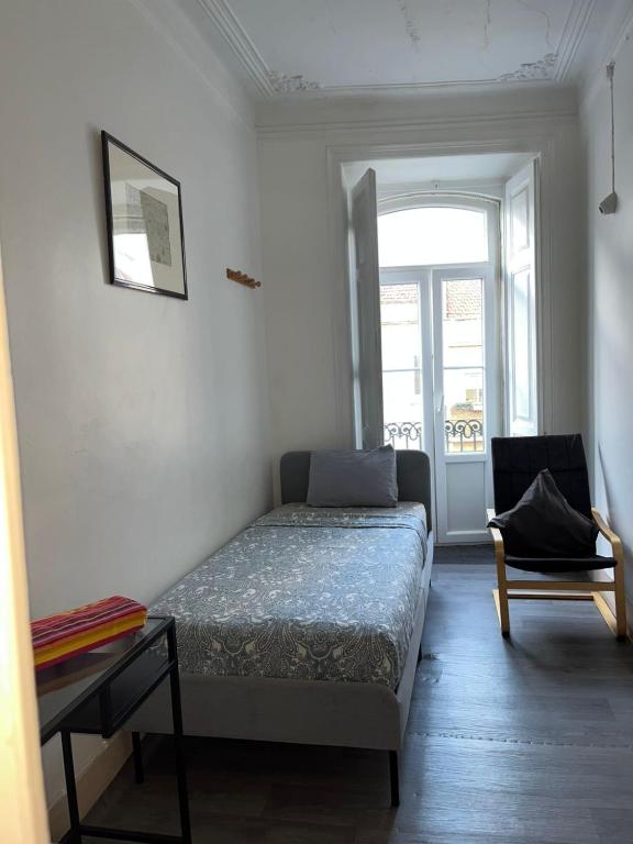 Postel nebo postele na pokoji v ubytování Sri-Indo Guest House