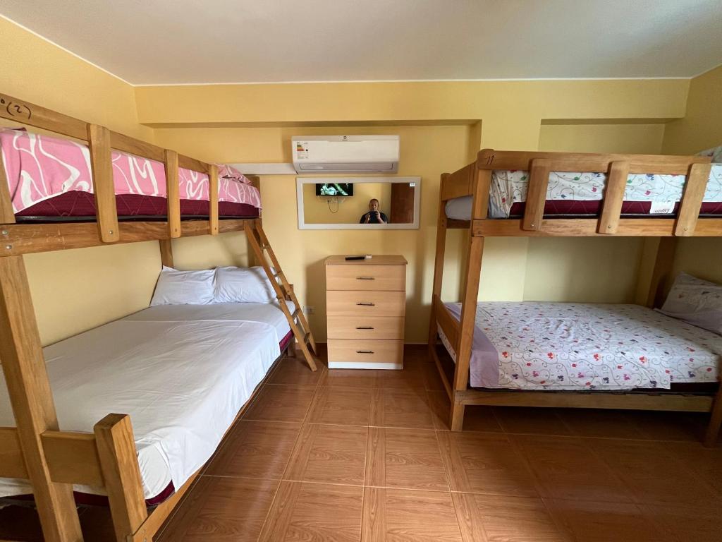Postel nebo postele na pokoji v ubytování Hospedaje Ola Marina