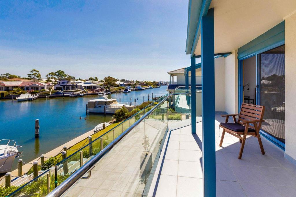 a balcony with a view of a marina at Locanda in Paynesville