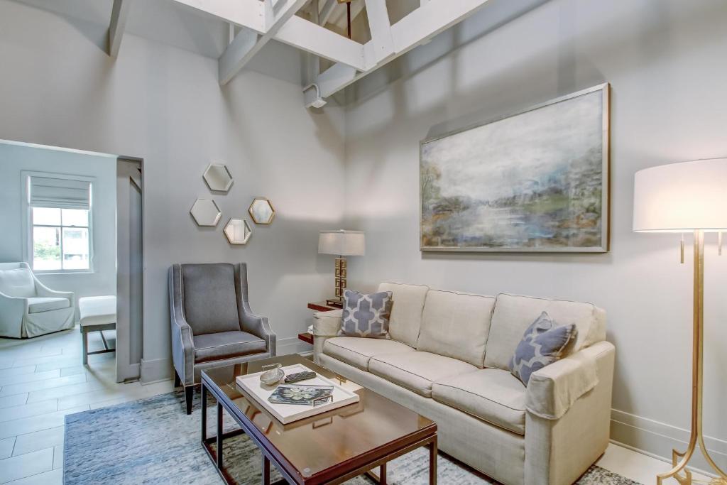 a living room with a couch and a table at Parker's Collection - 4 Bedroom in Savannah