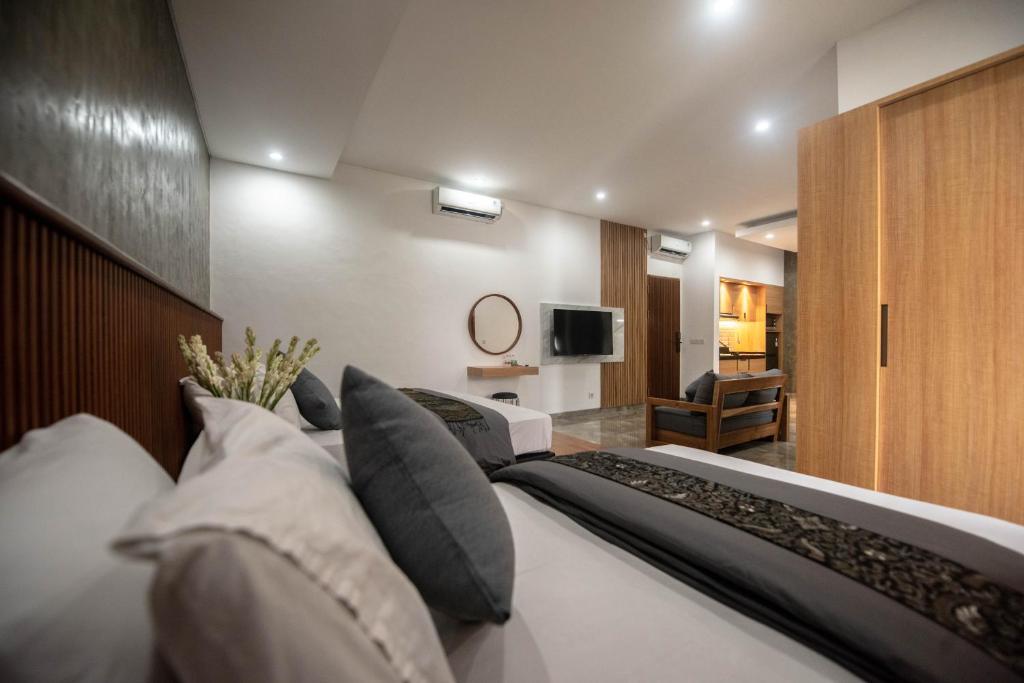 Postel nebo postele na pokoji v ubytování Sandat Hotel Legian