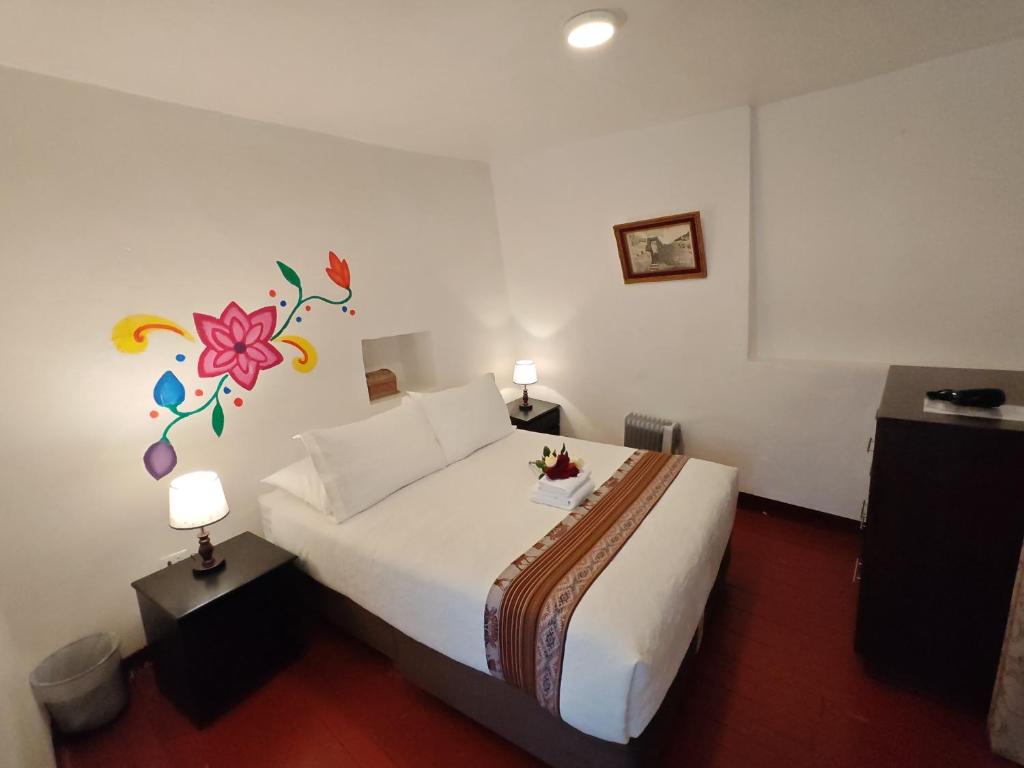 Postel nebo postele na pokoji v ubytování Gringo Bill's Cusco