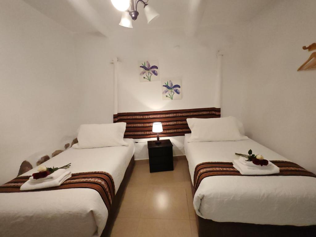 Postel nebo postele na pokoji v ubytování Gringo Bill's Cusco