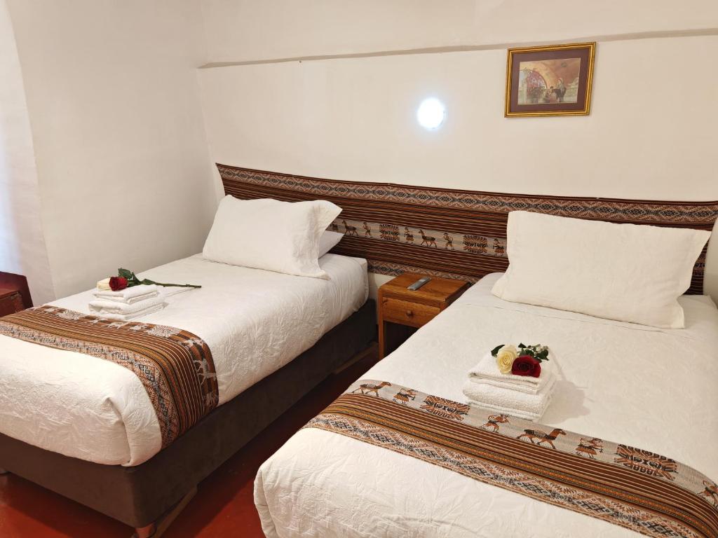 Postel nebo postele na pokoji v ubytování Gringo Bill's Cusco