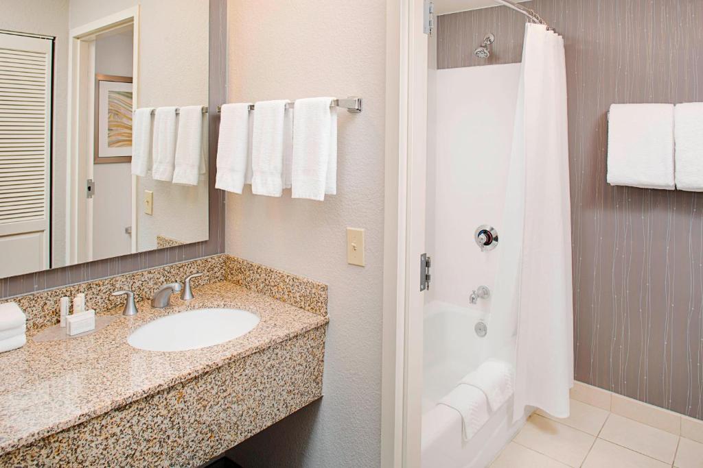 a bathroom with a sink and a shower at Courtyard by Marriott Tucson Williams Centre in Tucson