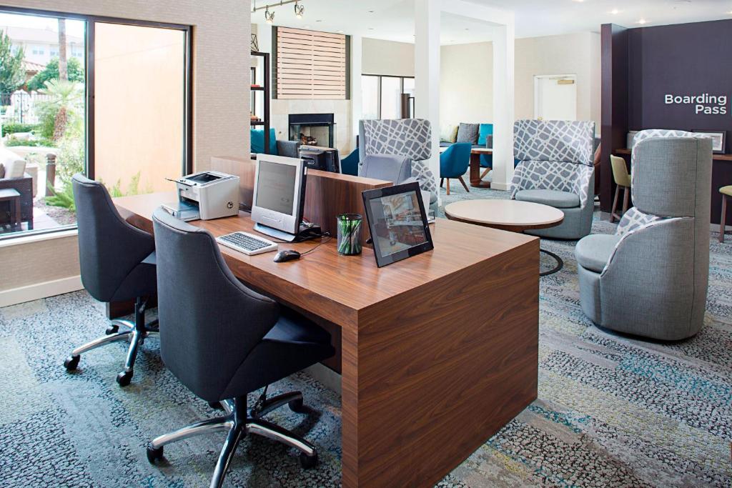 an office with a desk with two computers and chairs at Courtyard by Marriott Tucson Williams Centre in Tucson