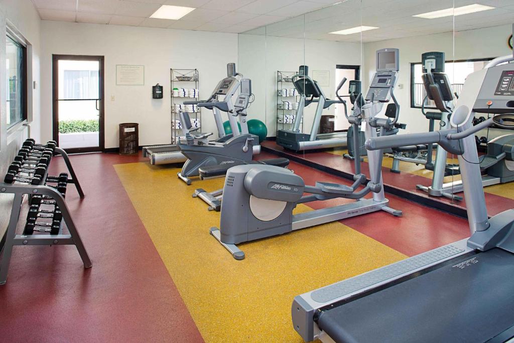 a gym with treadmills and elliptical machines at Courtyard by Marriott Tucson Williams Centre in Tucson
