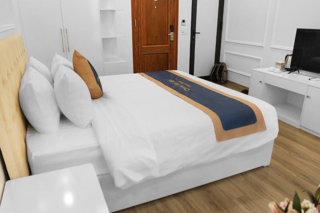 Postel nebo postele na pokoji v ubytování Chemi Hanoi Airport Hotel
