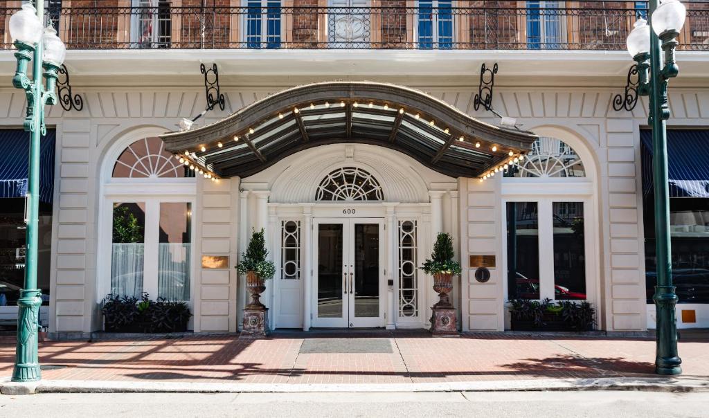 a large white building with a large entrance at The Lafayette New Orleans by Kasa Living in New Orleans