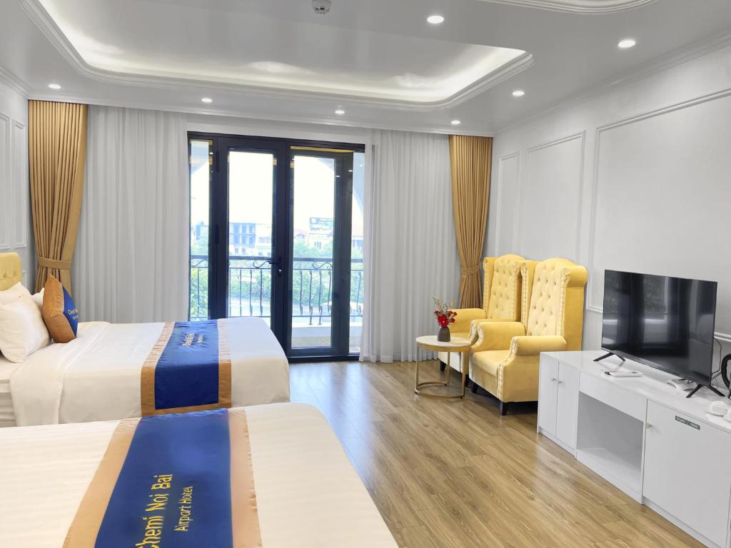 TV a/nebo společenská místnost v ubytování Chemi Hanoi Airport Hotel