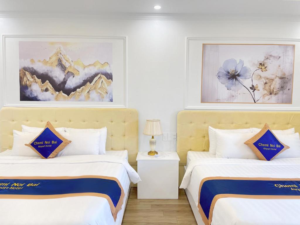 Postel nebo postele na pokoji v ubytování Chemi Hanoi Airport Hotel
