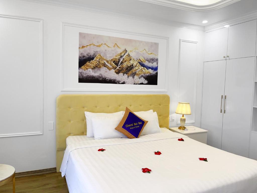 Postel nebo postele na pokoji v ubytování Chemi Hanoi Airport Hotel