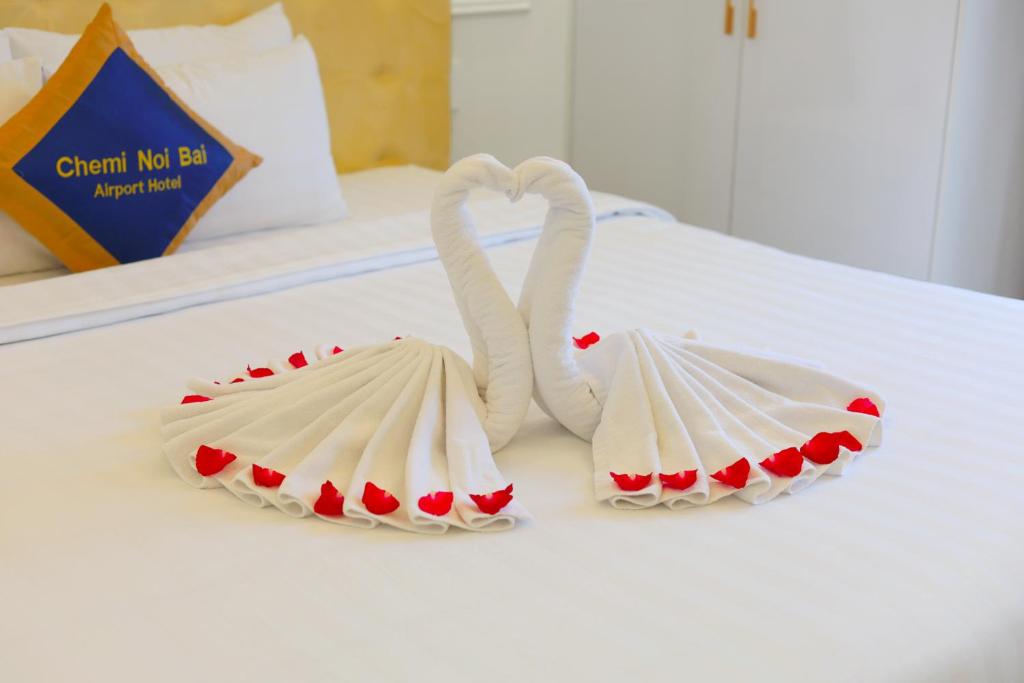 Postel nebo postele na pokoji v ubytování Chemi Hanoi Airport Hotel