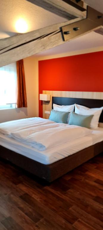 Postel nebo postele na pokoji v ubytování Hotel Pflug