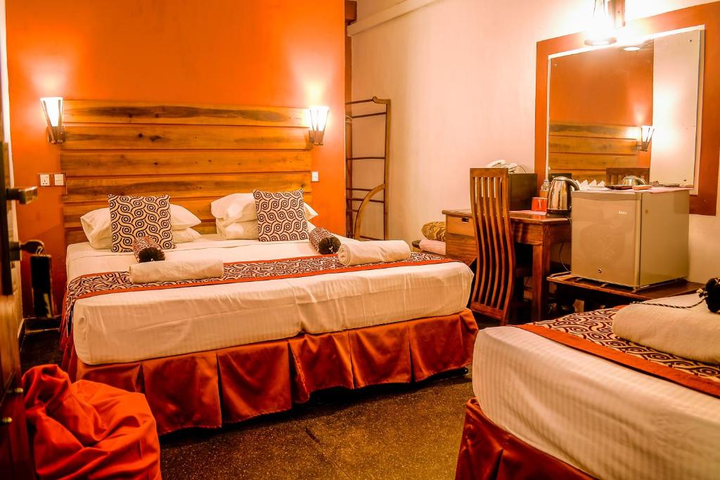 Postel nebo postele na pokoji v ubytování Hotel Sunray