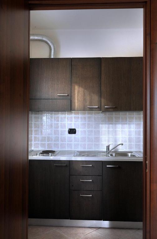 Kuchyň nebo kuchyňský kout v ubytování Hotel La Quercia