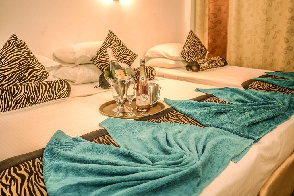 Postel nebo postele na pokoji v ubytování Hotel Sunray