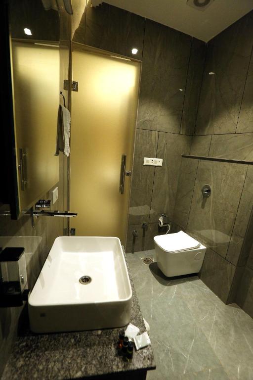 Koupelna v ubytování Hotel GC Grand Inn