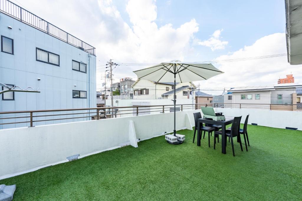 Patio nebo venkovní prostory v ubytování Yokkaichi Guest House