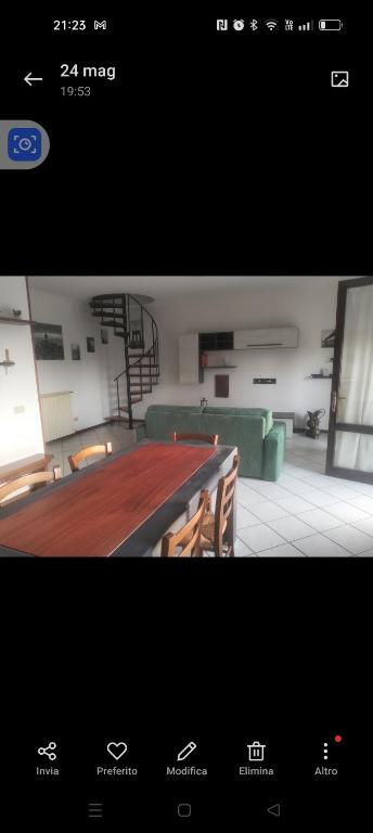 a picture of a room with a table and chairs at Esperia in Caorle