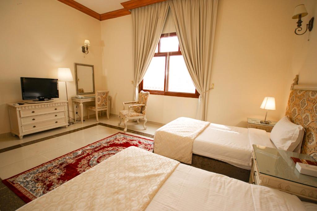 Postel nebo postele na pokoji v ubytování Al Bada Hotel and Resort