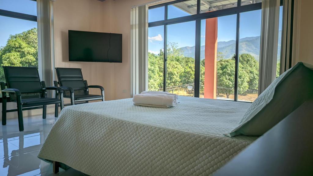 Postel nebo postele na pokoji v ubytování Lou Ela's Resort