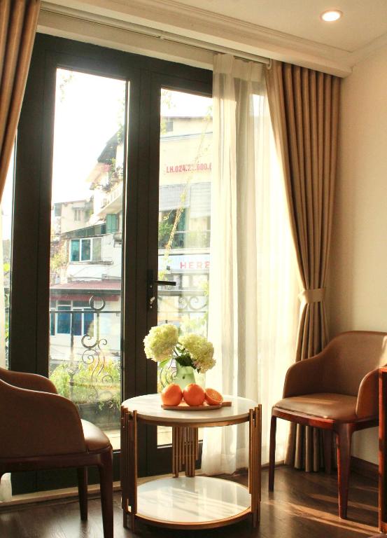 Posezení v ubytování DE LA SOIE Hotel & Travel
