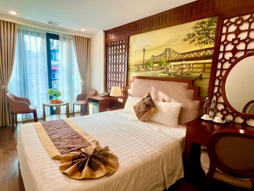 Postel nebo postele na pokoji v ubytování DE LA SOIE Hotel & Travel