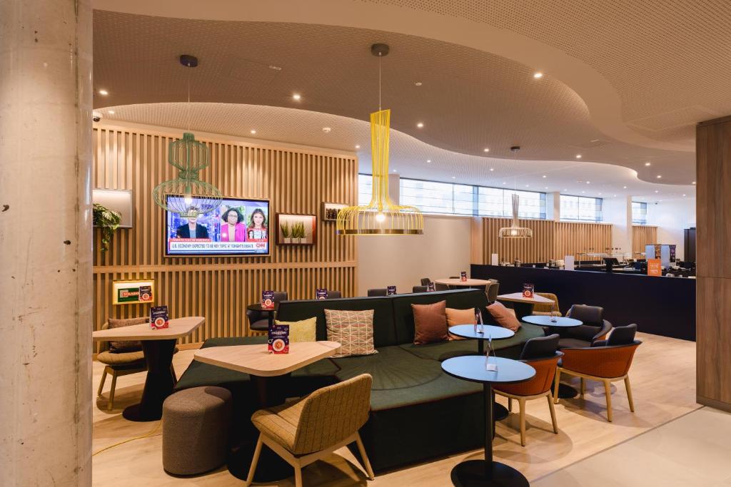 Телевизор и/или развлекательный центр в Hampton By Hilton Vienna City West