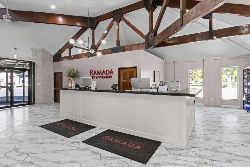a lobby with a reception desk in a building at Ramada by Wyndham Richfield UT I-70 in Richfield