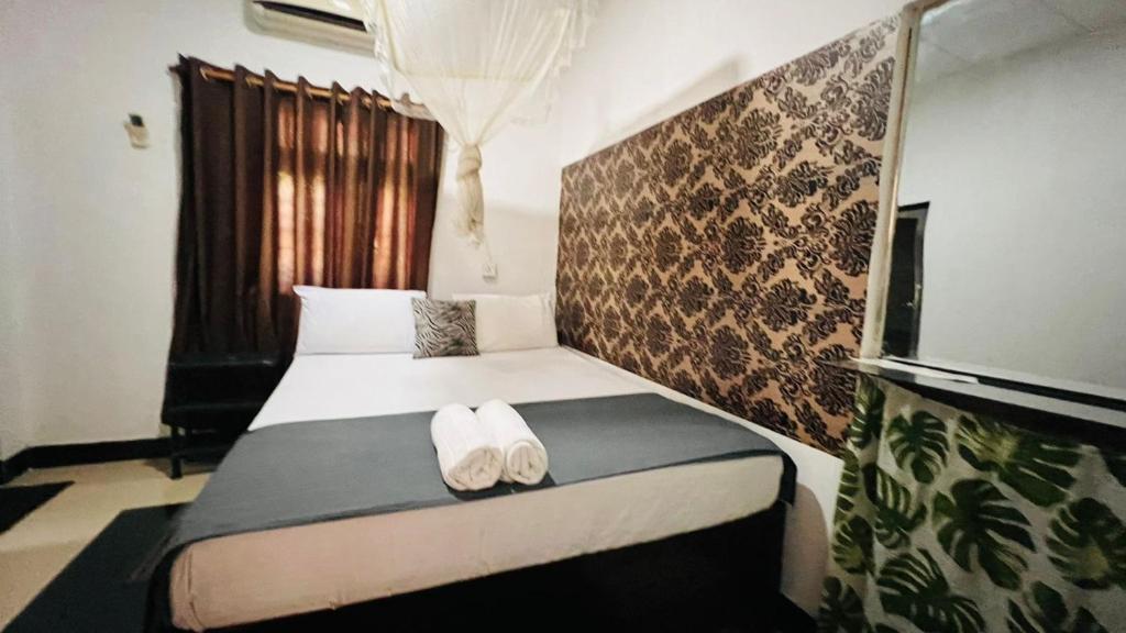Postel nebo postele na pokoji v ubytování Village feel home stay