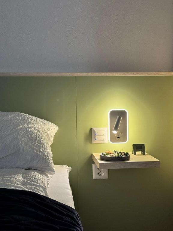 Postel nebo postele na pokoji v ubytování N's Hotel - Self-Check-in Hotel